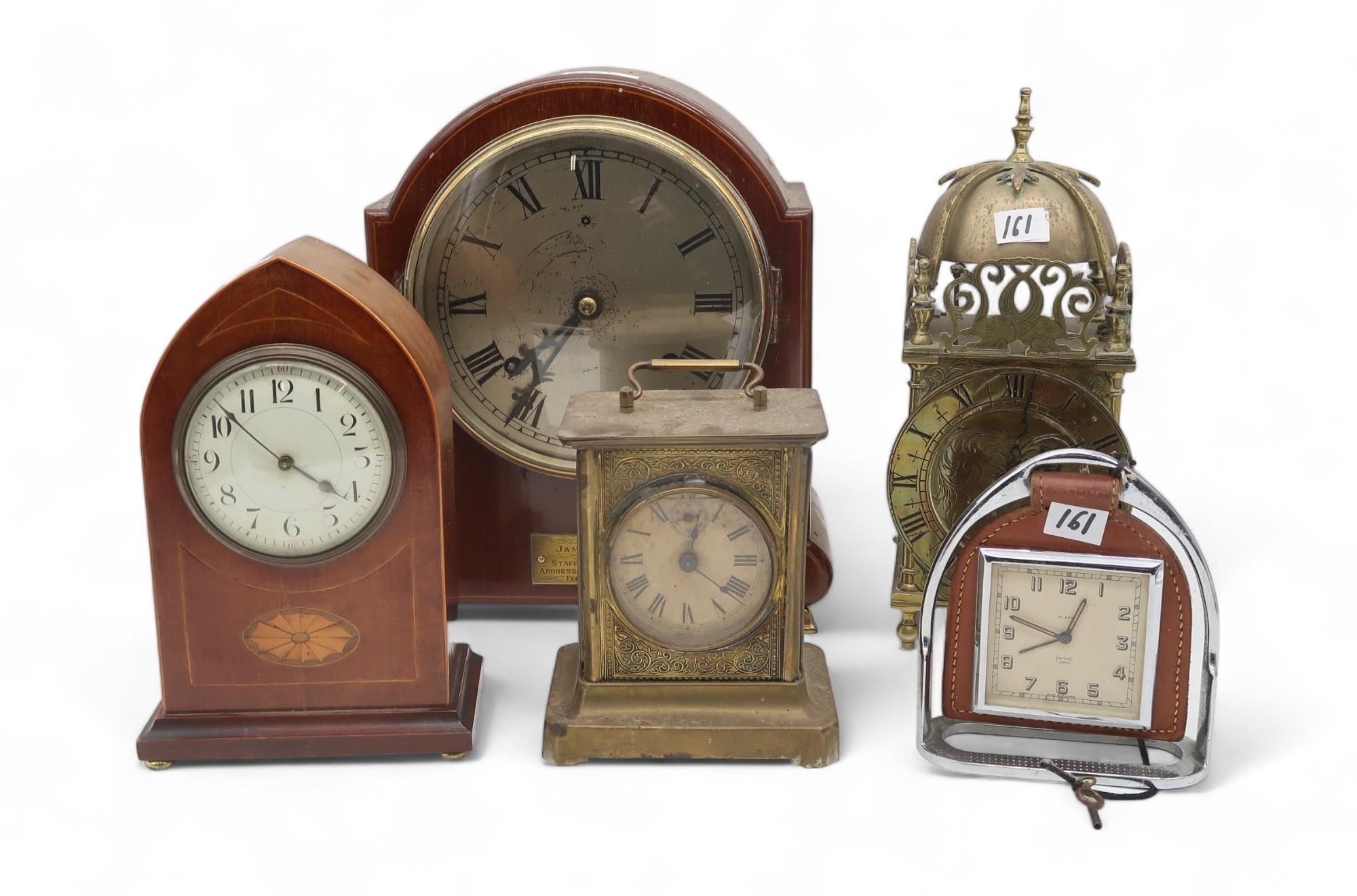 A collection of clocks including a lantern example