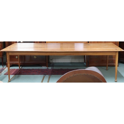 46 - A large mid 20th century stained teak boardroom/library table on tapering supports terminating in bu... 