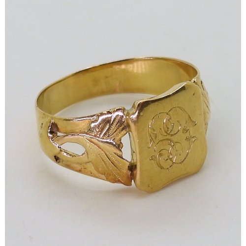 2761 - A FRENCH 18CT GOLD SIGNET RINGleaf design shoulders, monogramed CG, stamped with the french eagles h... 