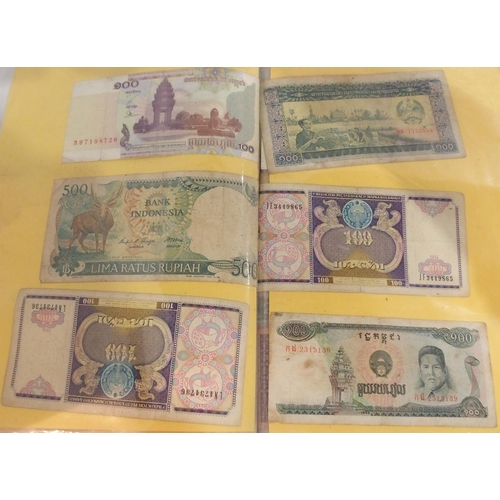 390 - A lot comprising South East Asian bank notes with examples from Cambodia, Laos, Vietnam and Burma (M... 