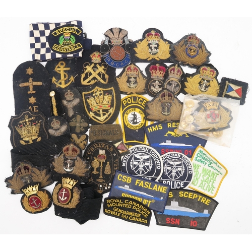 456 - A large quantity of bullion embroidered and other cloth uniform patches and epaulettes, including a ... 