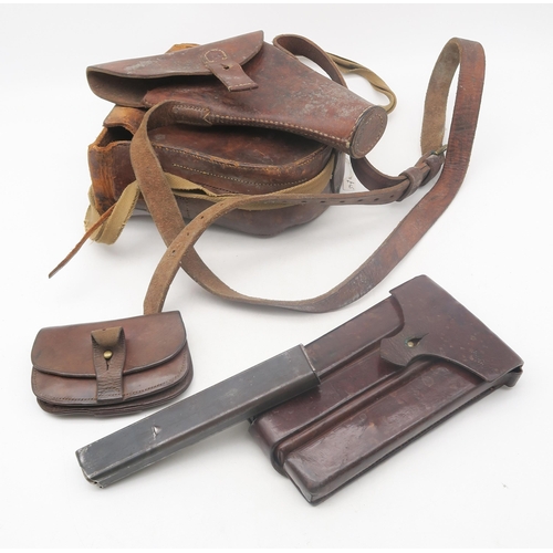 476 - A leather submachine gun magazine case, with contents; together with a WW2 US Colt 1911 holster, sta... 