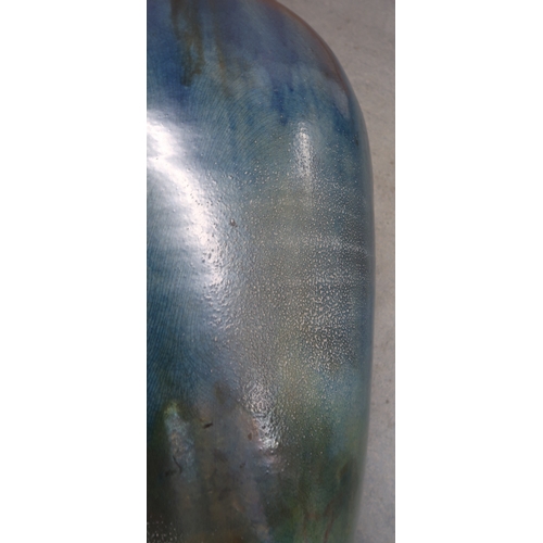 2323 - ALICE MACFARLANEAn oversized studio pottery vase of shouldered tapering form, in blue glaze, 95cm hi... 