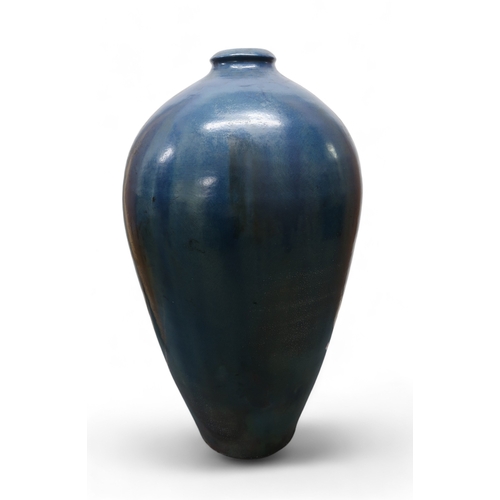 2323 - ALICE MACFARLANEAn oversized studio pottery vase of shouldered tapering form, in blue glaze, 95cm hi... 