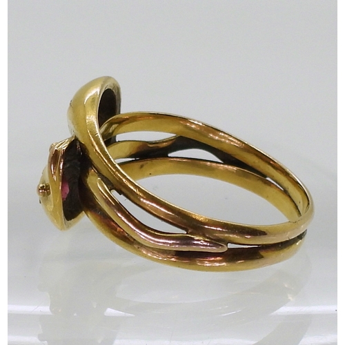 2775 - A SNAKE RINGthe double heads are set with a ruby and a red gem, Chester hallmarks for 1915, made by ... 