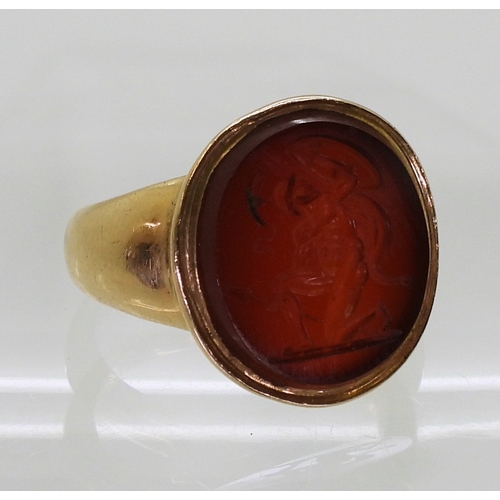 2776 - A GLADIATOR INTAGLIO RINGthe carved carnelian, is set in a yellow metal ring, the inner shank inscri... 