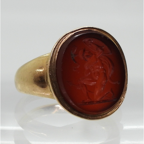 2776 - A GLADIATOR INTAGLIO RINGthe carved carnelian, is set in a yellow metal ring, the inner shank inscri... 