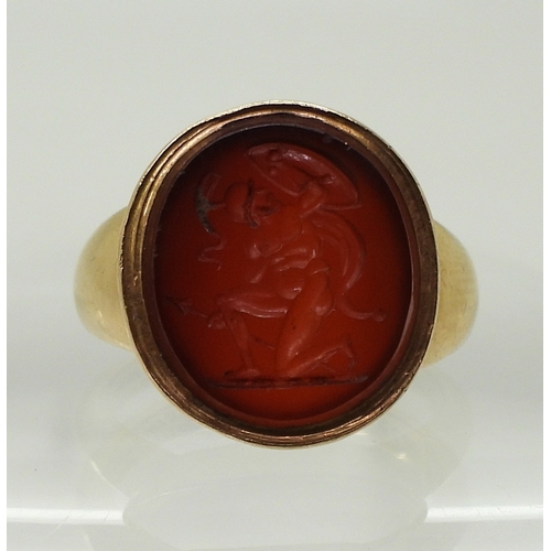 2776 - A GLADIATOR INTAGLIO RINGthe carved carnelian, is set in a yellow metal ring, the inner shank inscri... 