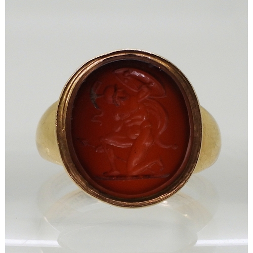 2776 - A GLADIATOR INTAGLIO RINGthe carved carnelian, is set in a yellow metal ring, the inner shank inscri... 