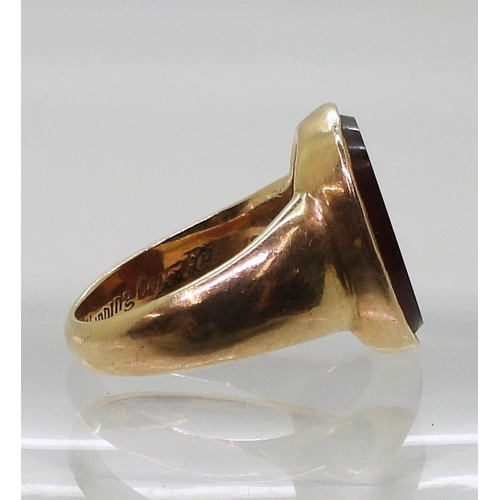 2776 - A GLADIATOR INTAGLIO RINGthe carved carnelian, is set in a yellow metal ring, the inner shank inscri... 