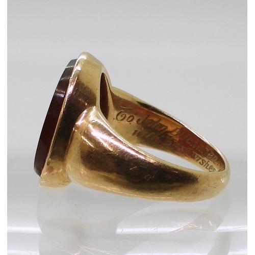 2776 - A GLADIATOR INTAGLIO RINGthe carved carnelian, is set in a yellow metal ring, the inner shank inscri... 