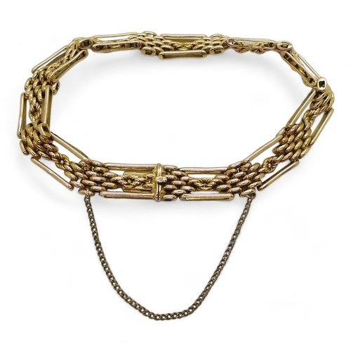 2778 - A FANCY LINK GATE BRACELETmade in 15ct gold, length 21cm, weight 24.1gms