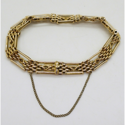 2778 - A FANCY LINK GATE BRACELETmade in 15ct gold, length 21cm, weight 24.1gms