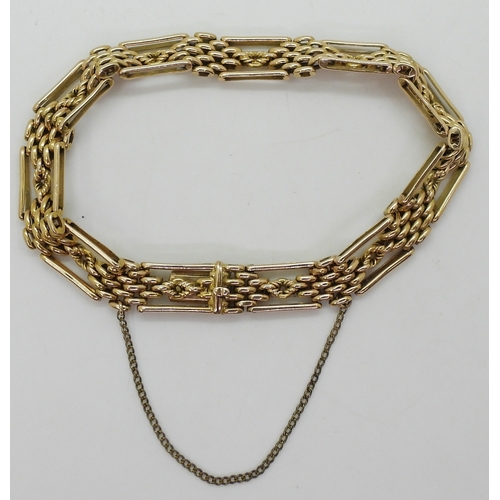 2778 - A FANCY LINK GATE BRACELETmade in 15ct gold, length 21cm, weight 24.1gms