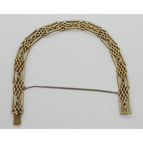 2778 - A FANCY LINK GATE BRACELETmade in 15ct gold, length 21cm, weight 24.1gms