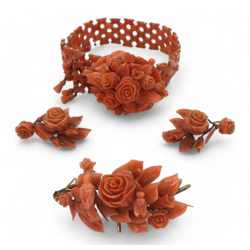 2779 - A SUITE OF CORAL JEWELSa bracelet, with carved flowers and leaves, yellow metal clasp, can be shorte... 