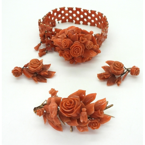 2779 - A SUITE OF CORAL JEWELSa bracelet, with carved flowers and leaves, yellow metal clasp, can be shorte... 