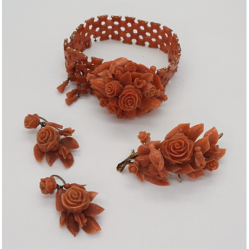 2779 - A SUITE OF CORAL JEWELSa bracelet, with carved flowers and leaves, yellow metal clasp, can be shorte... 