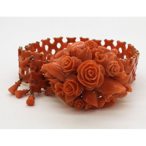 2779 - A SUITE OF CORAL JEWELSa bracelet, with carved flowers and leaves, yellow metal clasp, can be shorte... 