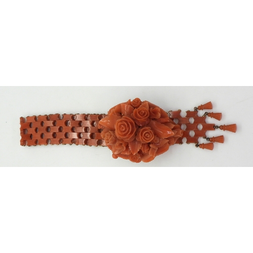 2779 - A SUITE OF CORAL JEWELSa bracelet, with carved flowers and leaves, yellow metal clasp, can be shorte... 