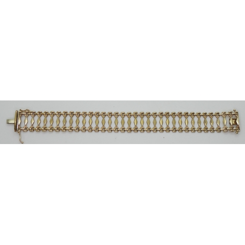 2780 - A 9CT GOLD BRACELETwith fancy baton links, length 19.5cm, width 1.8cm, weight 10.6gms... 