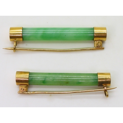 2782 - TWO CHINESE BROOCHESboth with bright yellow metal mounts and set with Chinese green hardstone, one m... 