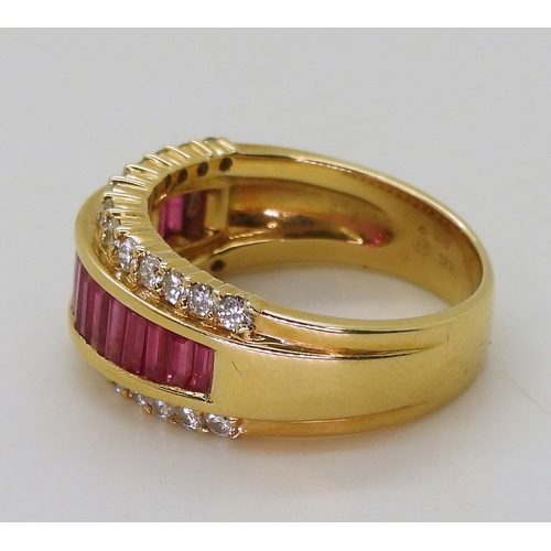 2783 - A RUBY & DIAMOND RINGmounted in 18ct gold, with a band of calibre cut ruby baguettes and two ban... 