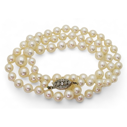 2786 - PEARLS WITH A DIAMOND CLASPthe clasp is in yellow and white metal and set with old cut diamonds with... 