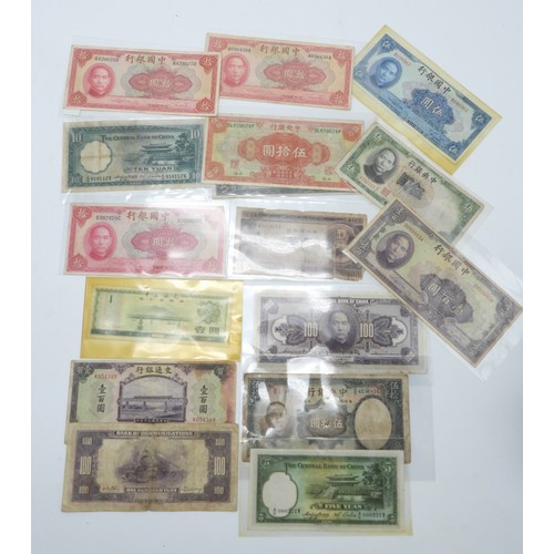 382 - A lot comprising Chinese bank notes Bank of China, Bank of Communications over stamped Shanghai, Cen... 