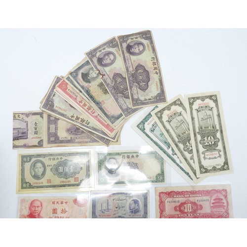 382 - A lot comprising Chinese bank notes Bank of China, Bank of Communications over stamped Shanghai, Cen... 