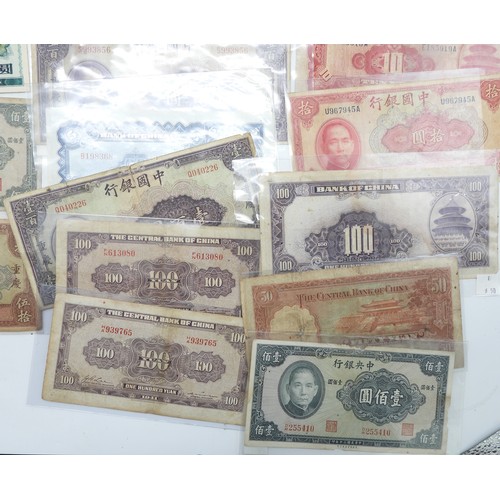 382 - A lot comprising Chinese bank notes Bank of China, Bank of Communications over stamped Shanghai, Cen... 