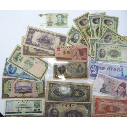 382 - A lot comprising Chinese bank notes Bank of China, Bank of Communications over stamped Shanghai, Cen... 