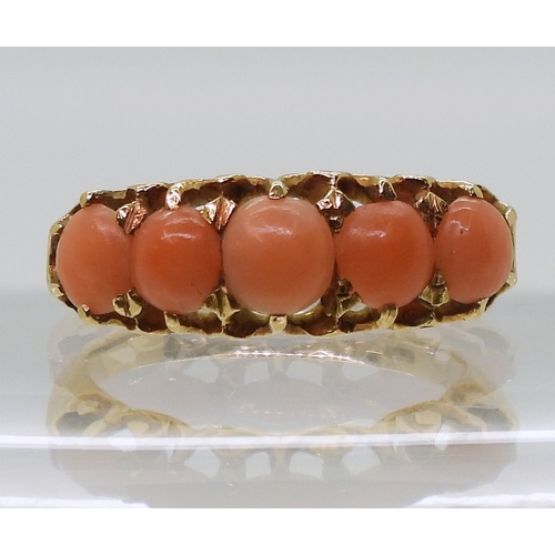 2787 - AN 18CT CORAL RINGwith Glasgow hallmarks for 1883, set with five corals to the classic scroll mount.... 