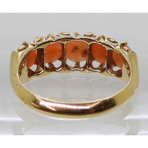 2787 - AN 18CT CORAL RINGwith Glasgow hallmarks for 1883, set with five corals to the classic scroll mount.... 