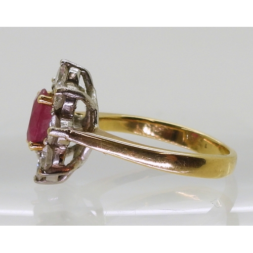 2788 - AN 18CT GOLD RUBY & DIAMOND RINGset with an 7.9mm x 5.9mm x 2.9mm, oval cut ruby, surrounded wit... 