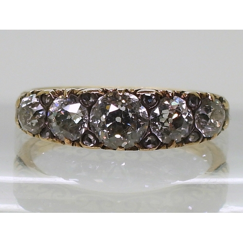 2792 - A FIVE STONE DIAMOND RINGthe five diamond are set in a classic scroll mount, with an estimated appro... 