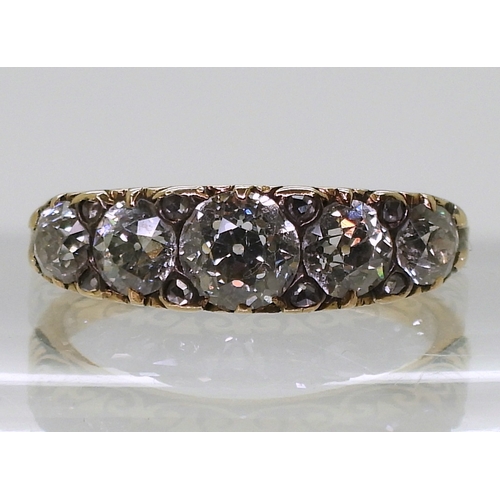 2792 - A FIVE STONE DIAMOND RINGthe five diamond are set in a classic scroll mount, with an estimated appro... 