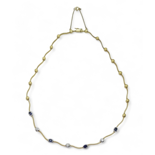 2805 - A SAPPHIRE AND DIAMOND NECKLACEthe necklace with wave shaped links and set with four oval cut sapphi... 