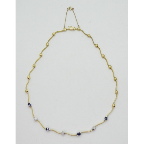 2805 - A SAPPHIRE AND DIAMOND NECKLACEthe necklace with wave shaped links and set with four oval cut sapphi... 