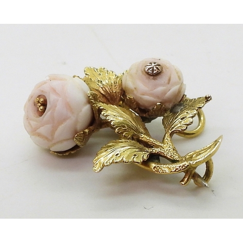 2807 - THREE VINTAGE BROOCHESa bright yellow metal roses brooch, set with two pink coral carved roses, leng... 