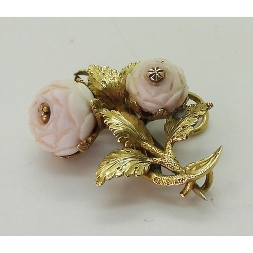 2807 - THREE VINTAGE BROOCHESa bright yellow metal roses brooch, set with two pink coral carved roses, leng... 