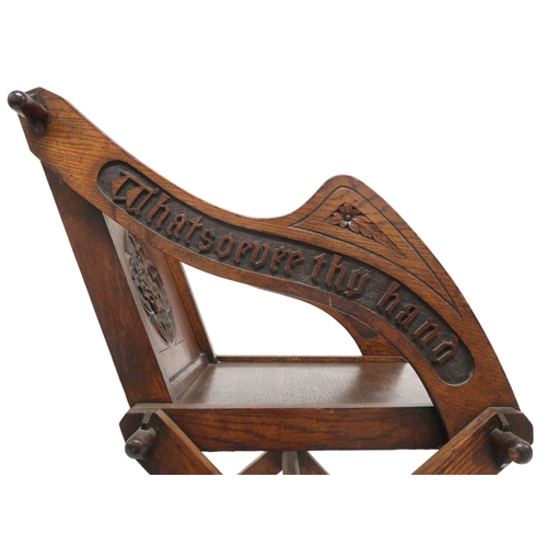 2002 - A 19TH CENTURY OAK PUGINESQUE STYLE GLASTONBURY CHAIR backrest and arms carved with bible verse... 