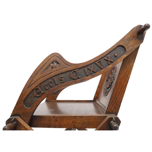 2002 - A 19TH CENTURY OAK PUGINESQUE STYLE GLASTONBURY CHAIR backrest and arms carved with bible verse... 