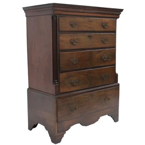 2008 - A GEORGIAN WALNUT CHEST ON CHEST with moulded cornice over four long drawers flanked by reeded ... 