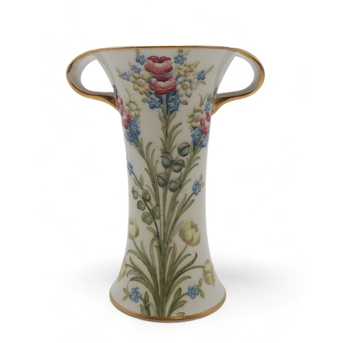 2236 - A WILLIAM MOORCROFT FOR JAMES MACINTYRE & CO FLORIAN WARE TWO HANDLED VASEof trumpet shape, tube... 