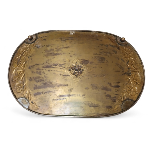 2244 - A SCOTTISH SCHOOL BRASS TRAYof oval form, with repoussé decoration of butterflies and flowers, 62cm ... 