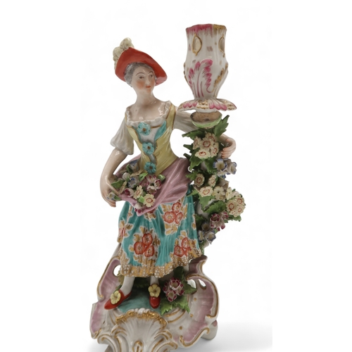 2252 - A PAIR OF DERBY PORCELAIN FIGURAL CANDLESTICKSmodelled as a woman with a floral dress holding flower... 