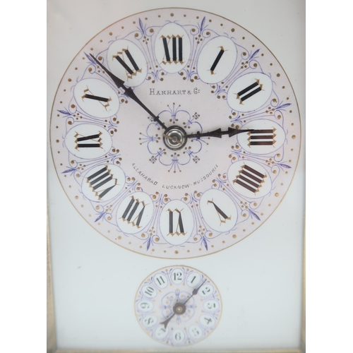 2257 - A HANHART BRASS AND WHITE METAL REPEATING CARRIAGE CLOCKthe white enamel face with lilac and purple ... 