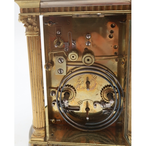 2257 - A HANHART BRASS AND WHITE METAL REPEATING CARRIAGE CLOCKthe white enamel face with lilac and purple ... 