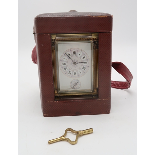 2257 - A HANHART BRASS AND WHITE METAL REPEATING CARRIAGE CLOCKthe white enamel face with lilac and purple ... 